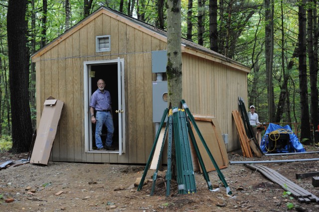 [The big shed (with lead engineer Frank Bowles in the doorway) is the main control shed. It has a 400-amp electrical service to provide power to dataloggers and controllers for 12 ant chambers and 9 plant chambers.]