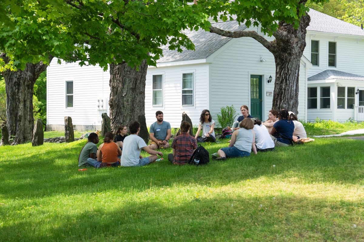 Image shows research interns and mentors meeting to discuss carbon tracking research.