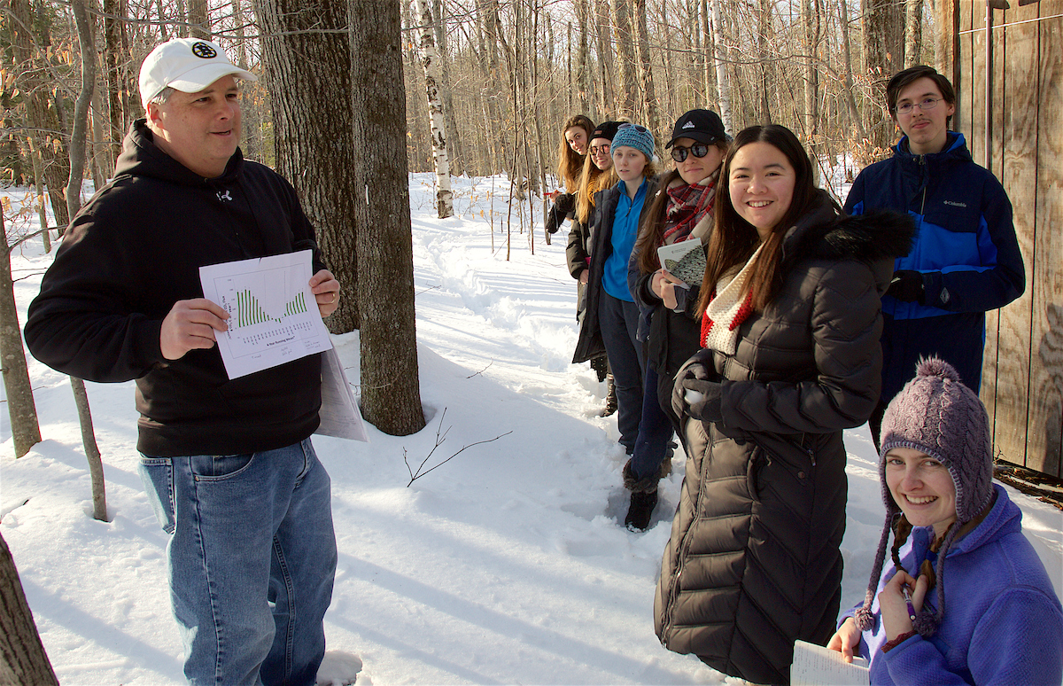 Professor Dave Orwig (left) discusses data with Freshman Seminar students