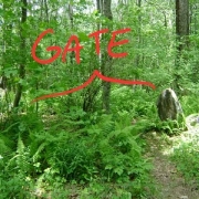 [Stone wall, blank spot, vertical stone, more wall. Hundreds of years ago, blank spot was a wooden gate.]